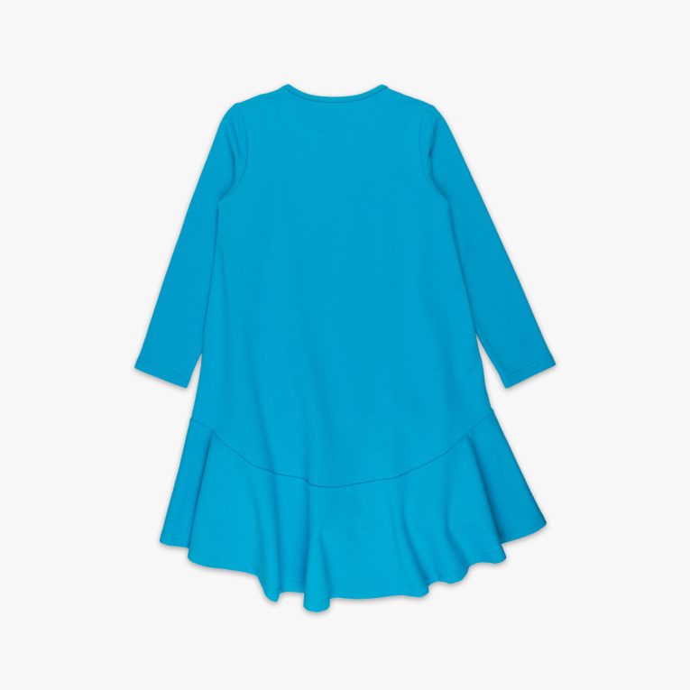 Loose dress is a loose fit dress, that goes wider to the bottom. It is longer on the back with a wide frilled trim at the bottom. Dress is in blue colour. Children, 3 -10 yrs. BonnyJoy - on the back