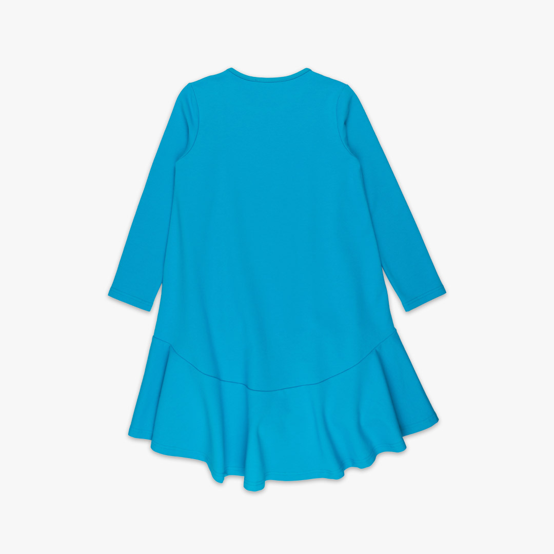 Loose dress is a loose fit dress, that goes wider to the bottom. It is longer on the back with a wide frilled trim at the bottom. Dress is in blue colour. Children, 3 -10 yrs. BonnyJoy - on the back