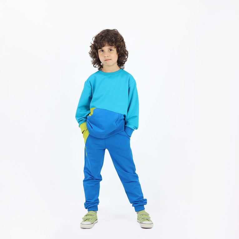 Big pocket sweatshirt is a regular fit top with an asymmetrical big pocket in front. A colour block design that comes in a combo of three colours - electric blue, deep blue, bright lime. Another front view, a boy dressed. Children, 3 -10 yrs. BonnyJoy