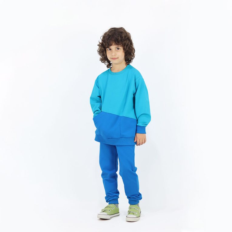 Big pocket sweatshirt is a regular fit top with an asymmetrical big pocket in front. A colour block design that comes in a combo of three colours - electric blue, deep blue, bright lime. Front view, a boy dressed. Children, 3 -10 yrs. BonnyJoy