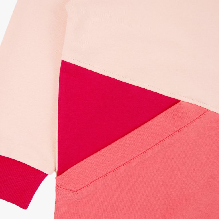 Big pocket sweatshirt is a regular fit top with an asymmetrical big pocket in front. A colour block design that comes in a combo of three colours - powder, salmon, raspberry. Front view, close-up. Children, 3 -10 yrs. BonnyJoy