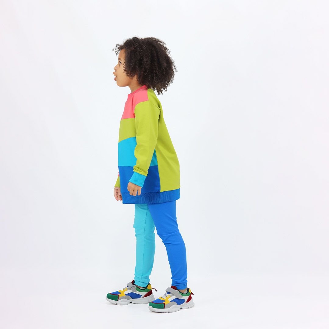 Four-Colour Sweatshirt is a regular fit top with colour block design. Right arm and the top part - salmon, left arm and the chest part - bright lime, belly part - electric blue, bottom part and the ribbed bottom hem - deep blue. The ribbed hand cuffs on the right is bright lime, on the left is electric blue. Side view. Children, 3 -10 yrs. BonnyJoy