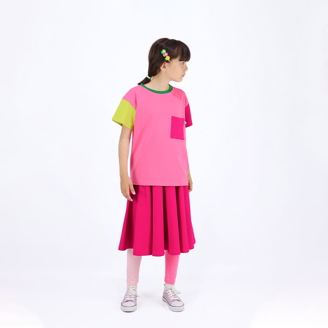 Our joyful skirt is a loose midi skirt in raspberry colour. Another front view. Children, 3 -10 yrs. BonnyJoy