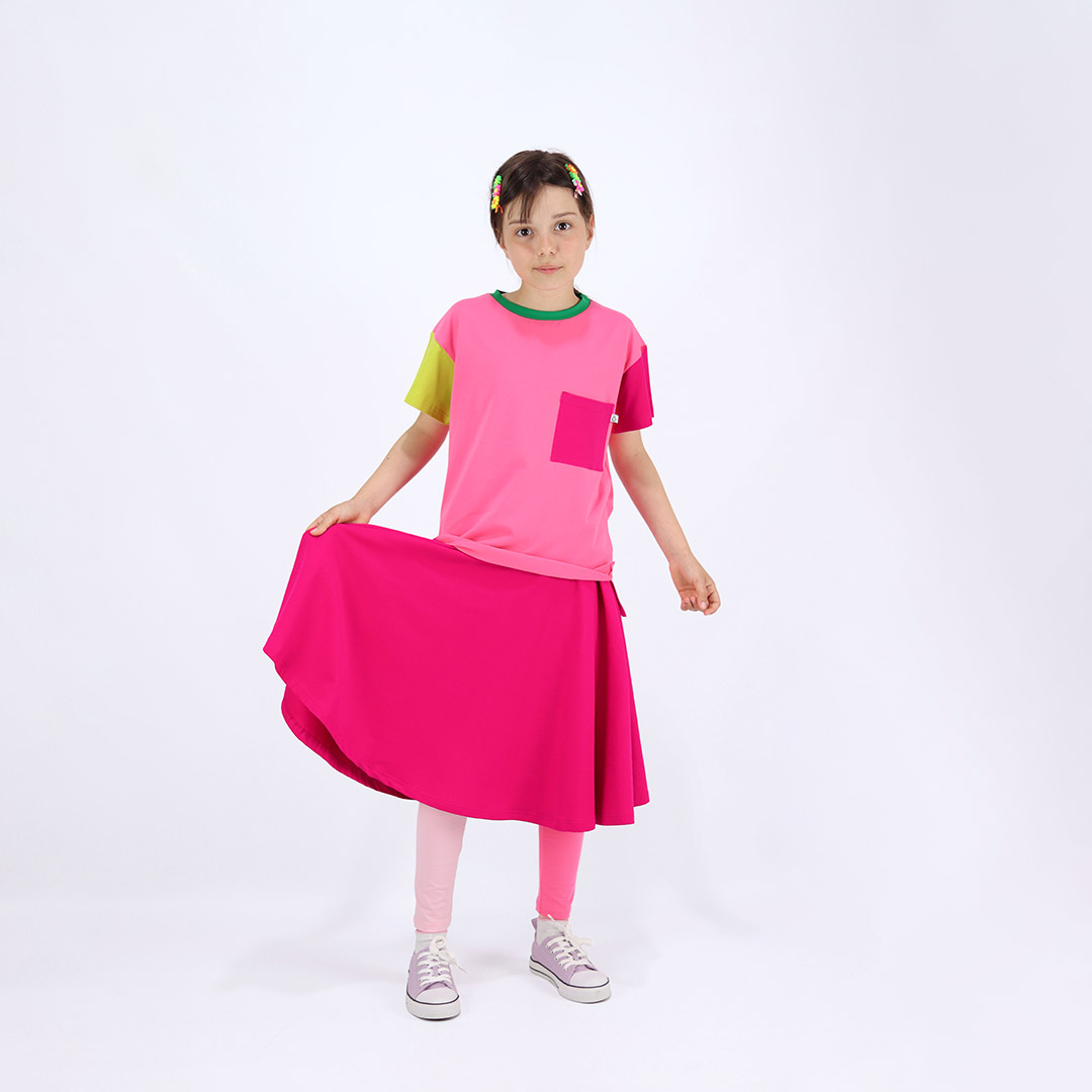 Our joyful skirt is a loose midi skirt in raspberry colour. One more front view. Children, 3 -10 yrs. BonnyJoy
