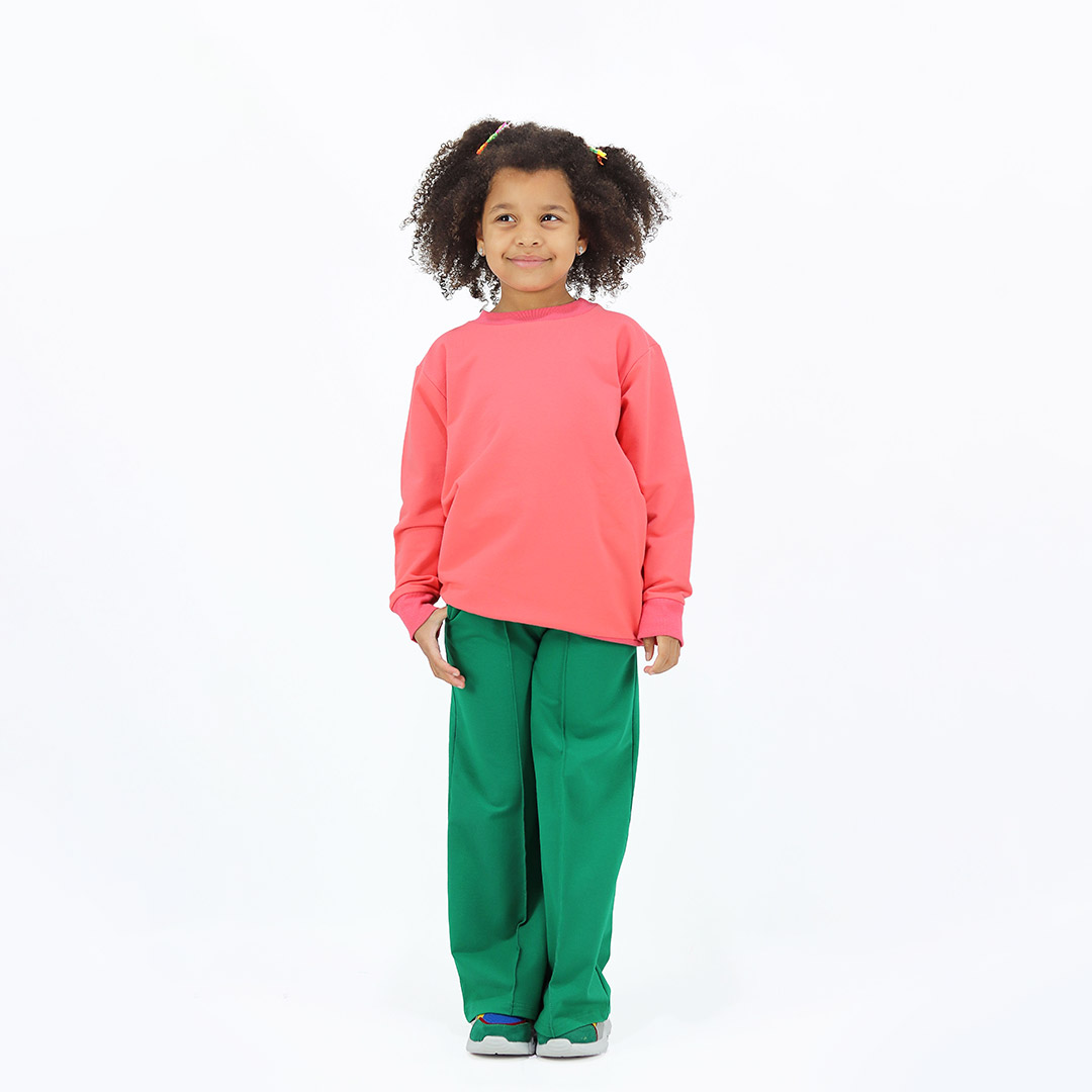 Joyful Sweatshirt is a loose fit top with minimalist design in salmon colour that features a ribbed neck, sleeve ends and bottom hem. Front view. Children, 3 -10 yrs. BonnyJoy