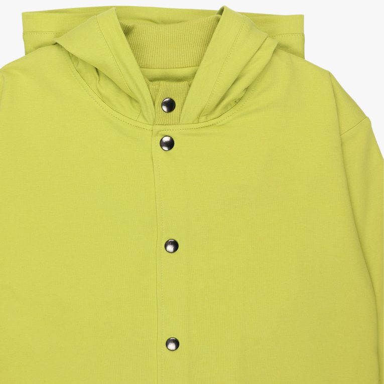 Long buttoned hoodie has a straight loose fit and minimalist design in bright lime colour. It closes up with snap buttons and features hign ribbed neck and ribbed hand cuffs and bottom hem. Front view, close-up. Children, 3 -10 yrs. BonnyJoy