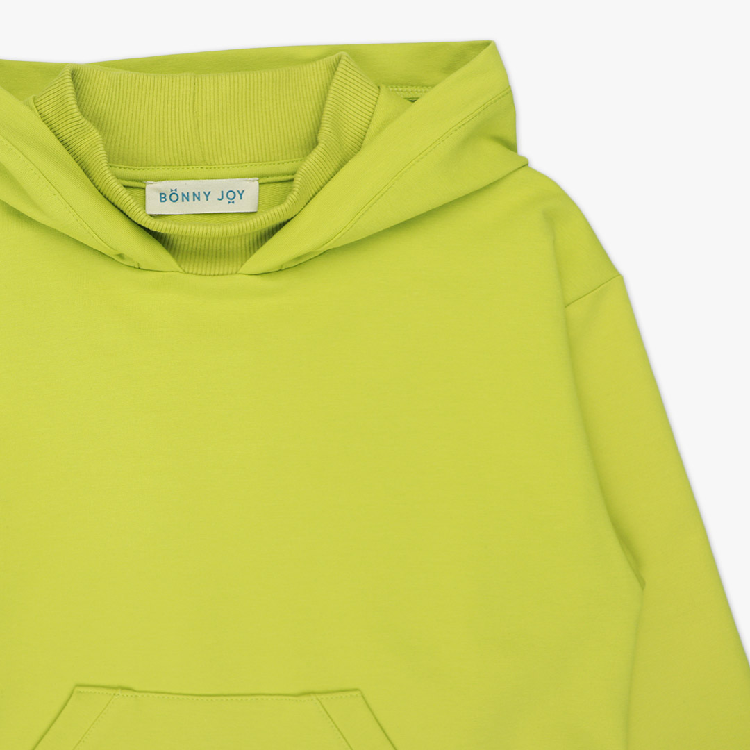 Long hoodie with high ribbed neck in bright lime colour. It features ribbed hand cuffs and a kangaroo pocket. The hoodie is a little longer on the back. Front view, close-up. Children, 3 -10 yrs. BonnyJoy