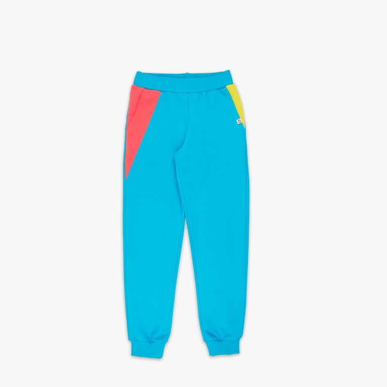 Slim Fit Colour Block Joggers are a pair of sweatpants in electric blue with two Italian type side pockets in different colours - salmon and bright lime. It features ribbed waist and cuffs. Front view, the joggers themselves. Children, 3 -10 yrs. BonnyJoy