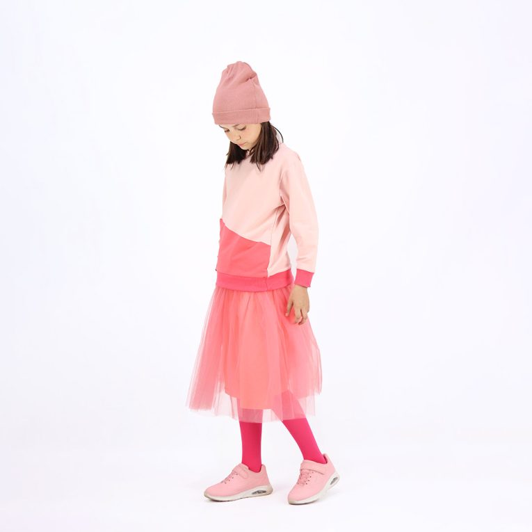 Our tulle skirt is a loose falling skirt made from tulle outside and jersey inside in salmon colour. Children, 3 -10 yrs. BonnyJoy