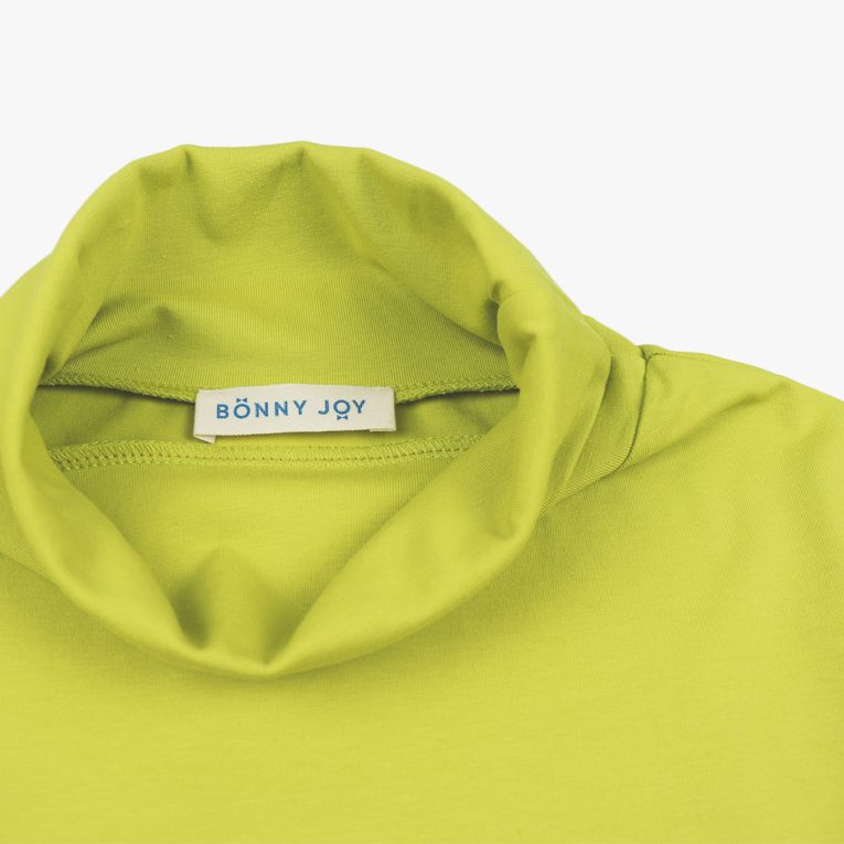Turtleneck loose top is a classic top loose on the neck in bright lime colour. Front view,close-up. Children, 3 -10 yrs. BonnyJoy