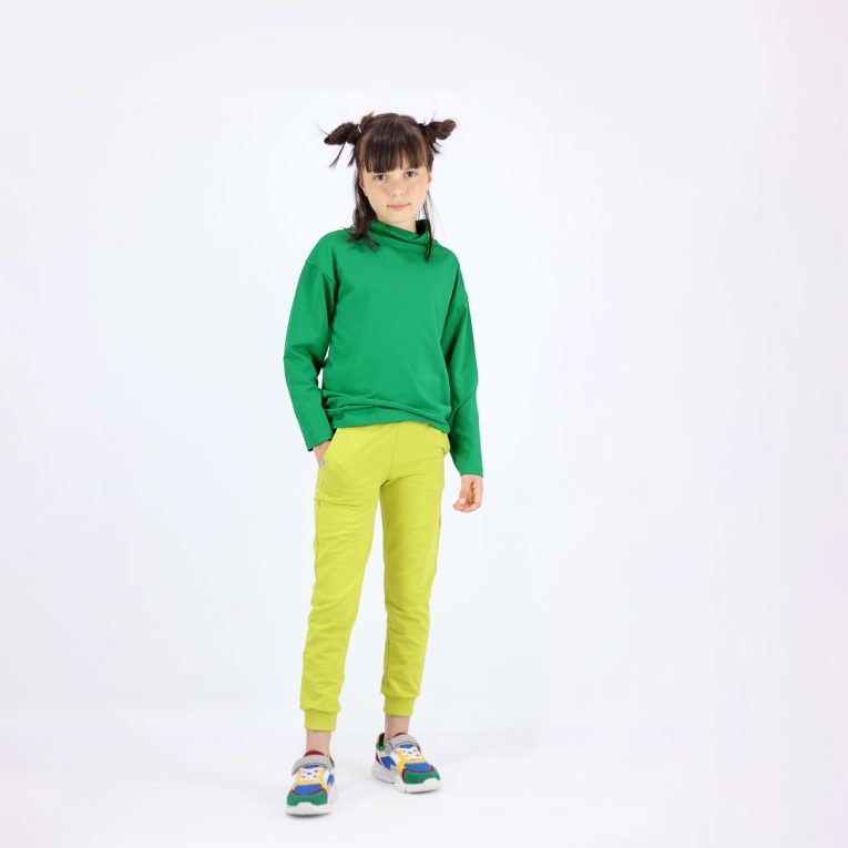 Turtleneck loose top is a classic top loose on the neck in green colour. Front view. Children, 3 -10 yrs. BonnyJoy