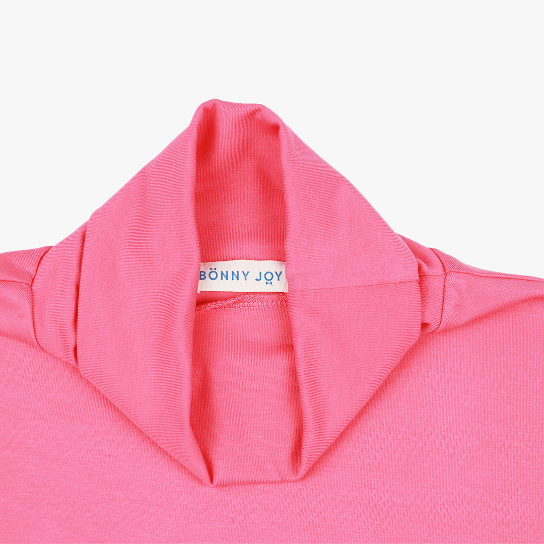 Turtleneck loose top is a classic top loose on the neck in pink colour. Front view, close-up. Children, 3 -10 yrs. BonnyJoy