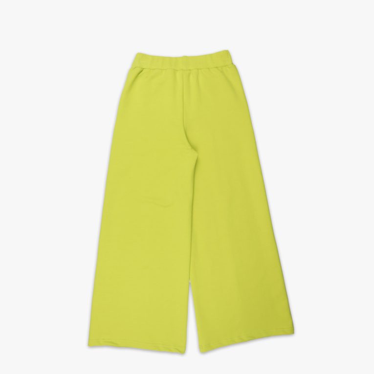 Wide leg pants with an edge hem in front and ribbed waist. Loose fit pants in bright lime colour. Back view. Children, 3 -10 yrs. BonnyJoy